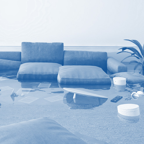 Cleanse Force UK flood and water damage cleanup in a flooded living room
